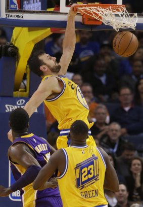Golden State Warriors centre Andrew Bogut, dunks against the Los Angeles Lakers.