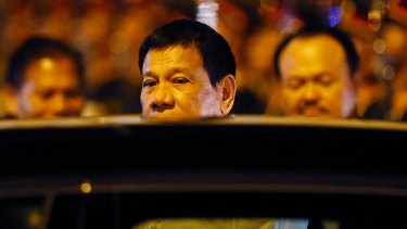Philippine President Rodrigo Duterte boards his limousine upon arrival in Vientiane, Laos.
