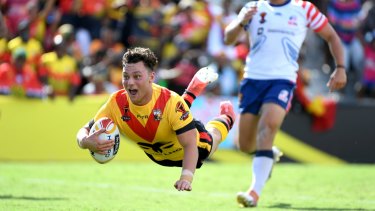 Questions: Lachlan Lam scores for PNG during a World Cup pool match in Port Moresby.