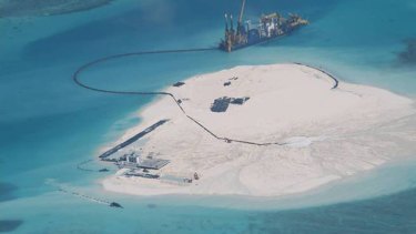 A photo taken Febuary 25, 2014 by surveillance planes a Chinese vessel is used to expand structures and land on the Johnson Reef, called Mabini by the Philippines and Chigua by China, at the Spratly Islands at South China Sea, Philippines.