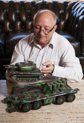 Don Gray with the restored model tank and fuel transporter designed by his father, which featured in The Canberra Times almost 50 years ago, 