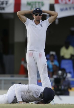 England's captain Alastair Cook gestures after missing a catch on the last day.