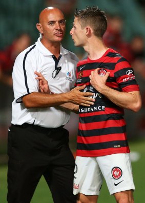 Shannon Cole of the Wanderers is assisted from the field after full-time.