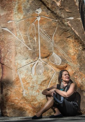  Canberra woman, Mikaela Jade, pictured with the Bill Nadji artwork at Reconciliation Place has been recognised for her working using technology to bring alive ancient Aboriginal stories.