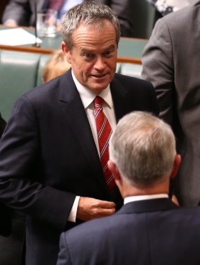 Opposition leader Bill Shorten greets Prime Minister Malcolm Turnbull after a division to suspend standing orders at Parliament House in Canberra on Tuesday.
