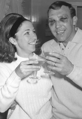 Bruised but not beaten: Bob Skilton celebrates his 1968 Brownlow Medal win with wife Marion.