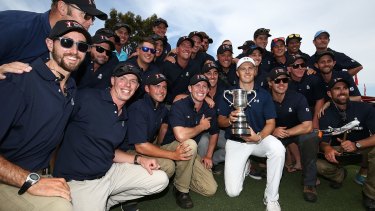 Spotlight: Jordan Spieth poses with greenkeeping staff and the Stonehaven trophy after winning the 2016 Australian Open at Royal Sydney Golf Club.