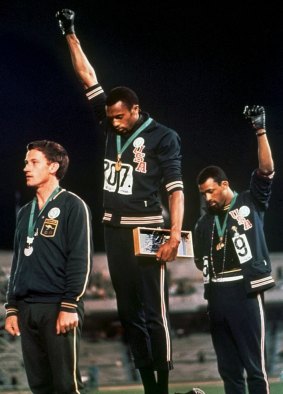 Iconic: Tommi Smith and John Carlos raise their fists in the 1968 Olympics.