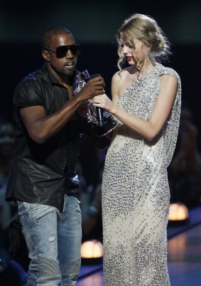Kanye West takes the microphone from singer Taylor Swift during the MTV Video Music Awards in 2009.  
