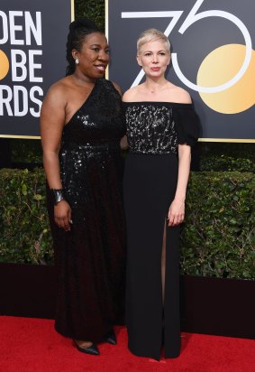 Me Too activist Tarana Burke, left, with Michelle Williams at the 75th annual Golden Globe Awards.