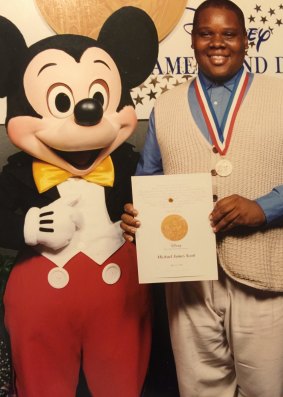 Scott receiving the Disney Dreamer and Doer Award, aged 13.