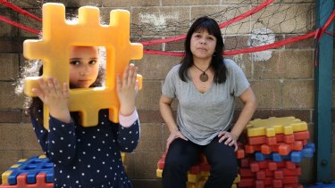 Childcare educator Patricia Rosas with five-year-old Antonella Blanco at the ABC childcare centre in Ultimo.