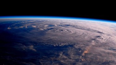 A photo taken from the International Space Station shows Hurricane Harvey over Texas on Saturday.