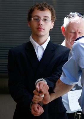 Daniel Jack Kelsall is led into a prison truck after being found guilty of murdering Morgan Huxley on March 18, 2015.