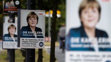 A poster with German Chancellor Angela Merkel, announcing an election rally of her Christian Democratic Union party for the Berlin state elections.
