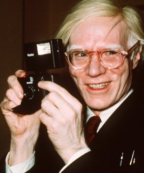Andy Warhol smiles in New York in 1976.