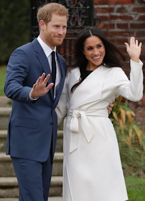 Prince Harry and his fiancee Meghan Markle pose for photographers at Kensington Palace in London after announcing their engagement.