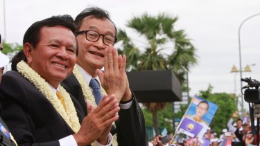 Opposition leader Kem Sokha, left, with his ill-fated predecessor Sam Rainsy in 2013.