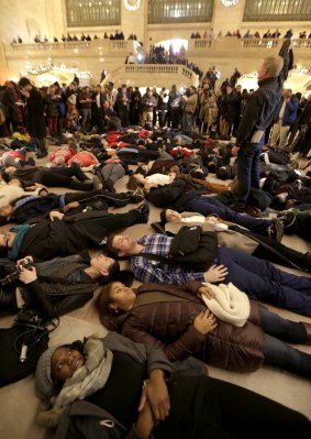 Protesters stage a "die-in" at New York's Grand Central Station after the decision was announced.