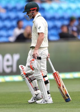 First domino to fall: Warner cuts a dejected figure as he walks off the ground in Hobart.