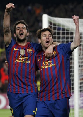 Brothers in arms: Cesc Fabregas and Lionel Messi during their time together at Barcelona.