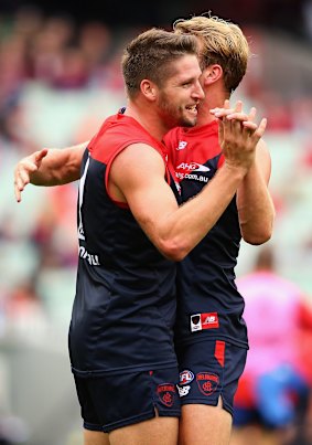 Jesse Hogan and Jack Watts of the Demons celebrate a goal.