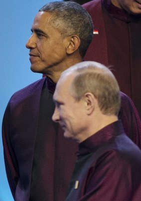 Terse relationship: US President Barack Obama and Russian President Vladimir Putin stand near each other during the Asia-Pacific Economic Co-operation Summit meeting in Beijing.