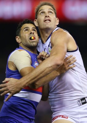 Brett Goodes of the Bulldogs competes for the ball against Aaron Sandilands of the Dockers.