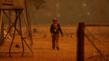 CFA Fireman Rodney Ridd as the Murrindindi fire approaches his property in February 2009.