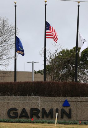 Flags are at half staff at Garmin headquarters in Olathe on Friday.