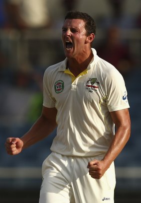 Australia's Josh Hazlewood savours his scalp of the West Indies' last remaining specialist batsman, Jermaine Blackwood, late on day two of the second Test at Sabina Park, Jamaica.