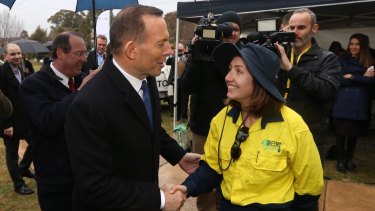 Former prime minister Tony Abbott visits a Green Army project in Queanbeyan in 2015. 