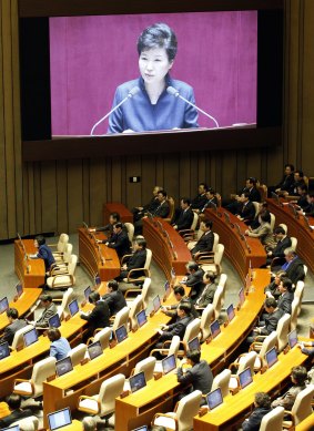 A huge screen shows Ms Park delivering her speech on Tuesday.
