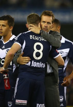 Different philosophies: Mike Mulvey hugs Besart Berisha of the Melbourne Victory after his final match in charge of the Brisbane Roar.