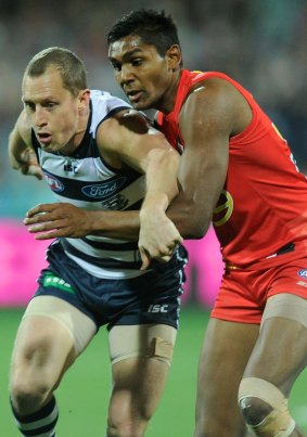 Geelong's James Kelly battles with Timmy Sumner in 2013.