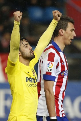 Villareal's Jaume Costa celebrates next to Atletico Madrid's Mario Mandzukic (right).