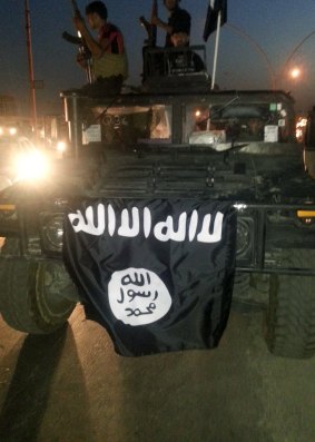 ISIL flag in Mosul, Iraq in June.
