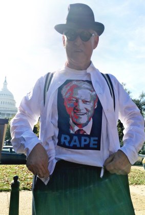 The money shot: Roger Stone reveals the Bill Clinton T-shirt under his suit.