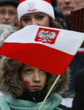 Protesters take part in an anti-government demonstration in Warsaw, Poland to protest against the role that President Andrzej Duda and the new conservative government have had in the swelling discord. 