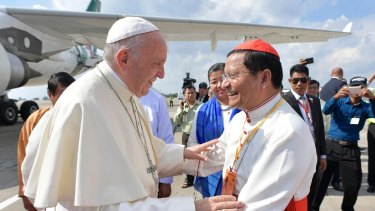 Pope Francis is welcomed by Cardinal Charles Maung Bo upon his arrival in Yangon, Myanmar.