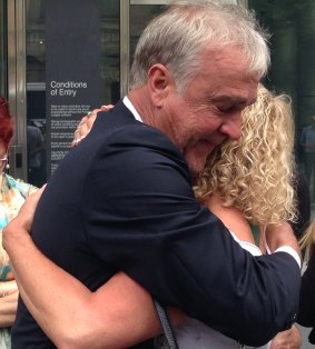 Katie Louise's parents Michael Broadbent and Teresa Doyle embrace outside the County Court on Friday.