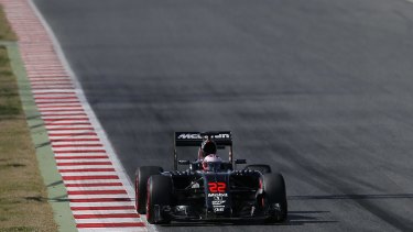 Jenson Button of McLaren-Honda steers his car during a testing session at the Catalunya track in Montmelo just outside of Barcelona.