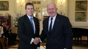 Christian Porter is sworn in as Minister for Social Services by Governor-General Sir Peter Cosgrove at Government House in Canberra on Monday.