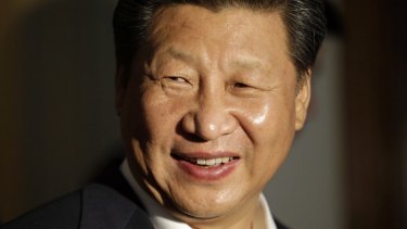 Chinese President Xi Jinping smiles as he concludes a visit to Lincoln High School in Tacoma, Washington, during his US visit.