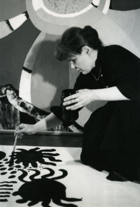 Maija Isola painting one of her bold patterns in the 1960s.