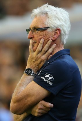 Little to cheer about: A grim-faced Mick Malthouse watches his 715th game as coach at the MCG on Friday night.