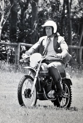 Prime Minister Malcolm Fraser rides his KTM 500cc motor cycle on his property in 1977.