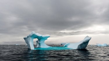 Blue iceberg floating in the sea near Cierva Cove on the  Antarctic Peninsula.