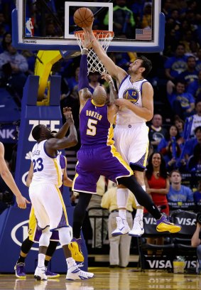 Health worry: Andrew Bogut blocks a shot by Carlos Boozer of the Los Angeles Lakers. 