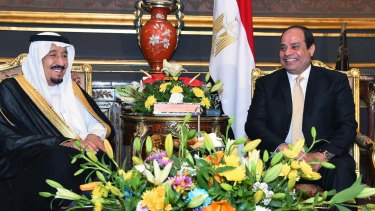 Egyptian President Abdel-Fattah el-Sissi, right, sits with Saudi Arabia's King Salman in the Abdeen Palace, Cairo.